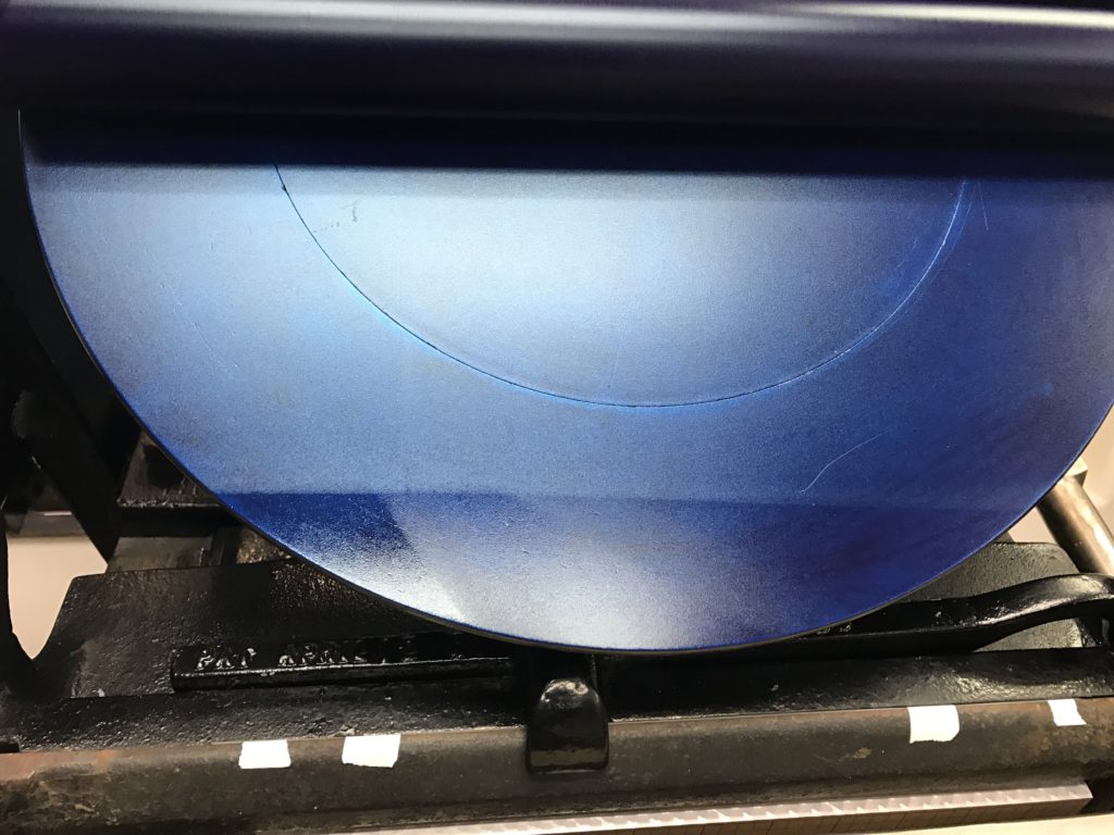 At the bottom of the ink disk, there is a mark where the rollers are lifting from the ink.